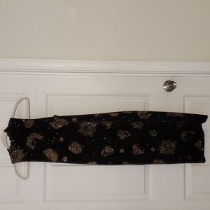 Small, 42" long, 8" slit in the back. Size 2 to 4.